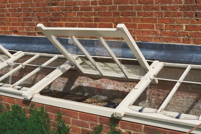 Small waterproof linear actuator FD16 installed on outdoor mini greenhouse ventilation window