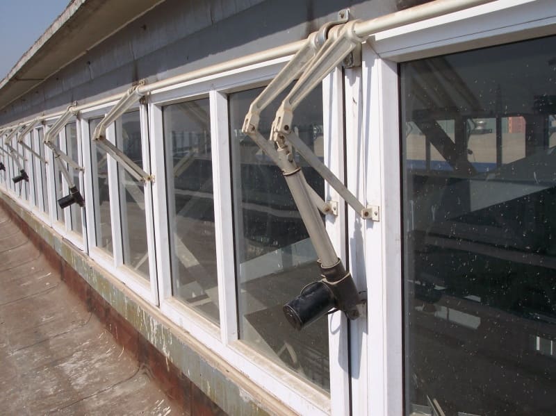 IP66 Low‑Noise Micro Linear Actuator mounted on outdoor farm automation equipment, non‑micro larger dimension